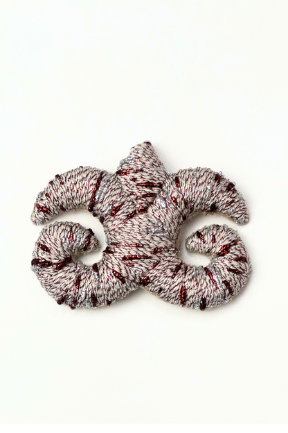 "Accel Erlanovna" Brooch | ivory with silver and burgundy lurex
